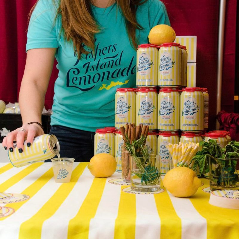 Photo of brand ambassador pouring canned cocktail into a glass to promote jobs & career opportunities to prospective employees